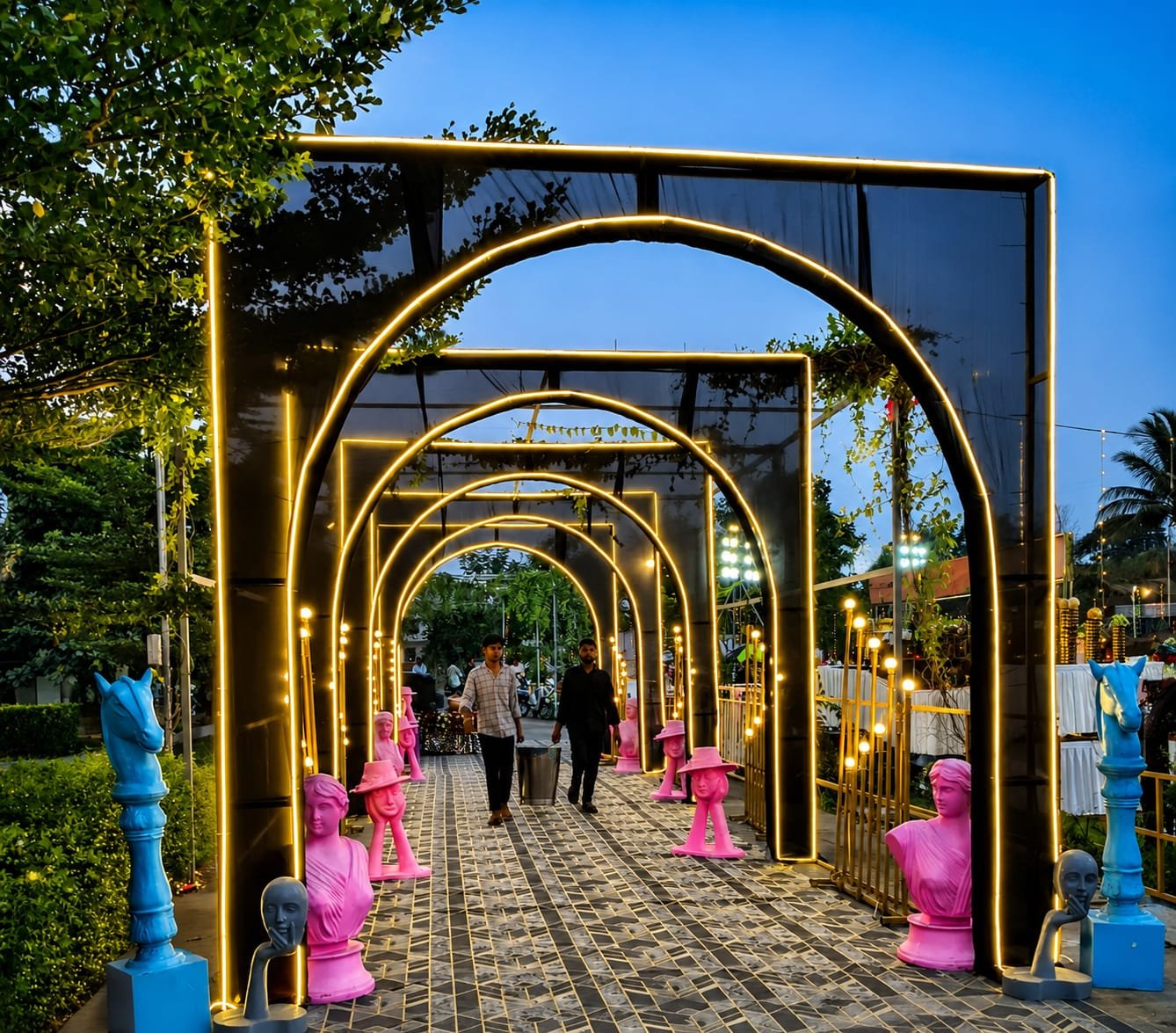 Neon-lit arch tunnel entrance wedding decoration by Nilesh Decorators Neral